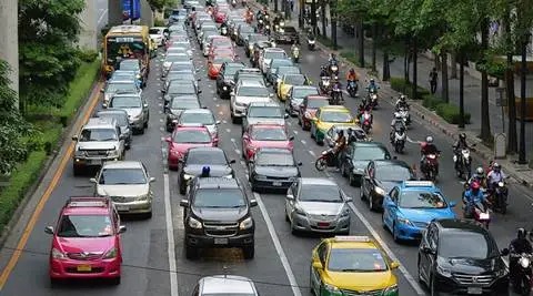 Traffic moving along a busy urban road